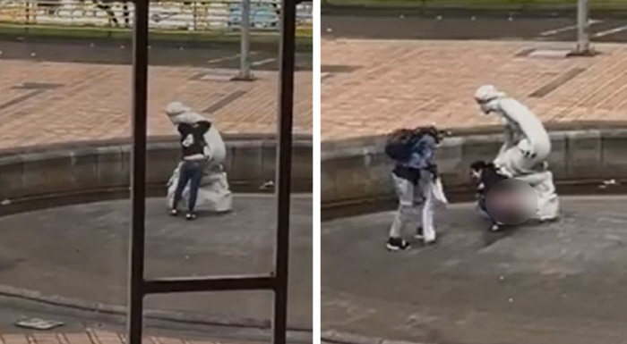 The woman who peed next to the statue of religion is laughing...Disgusting.