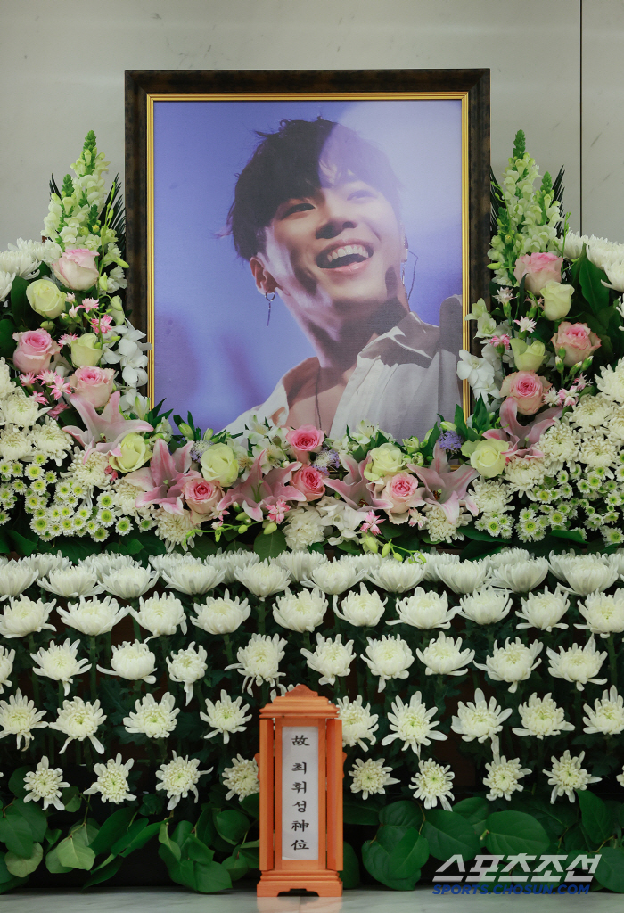  Wheesung smiling brightly in the portrait, sad appearance