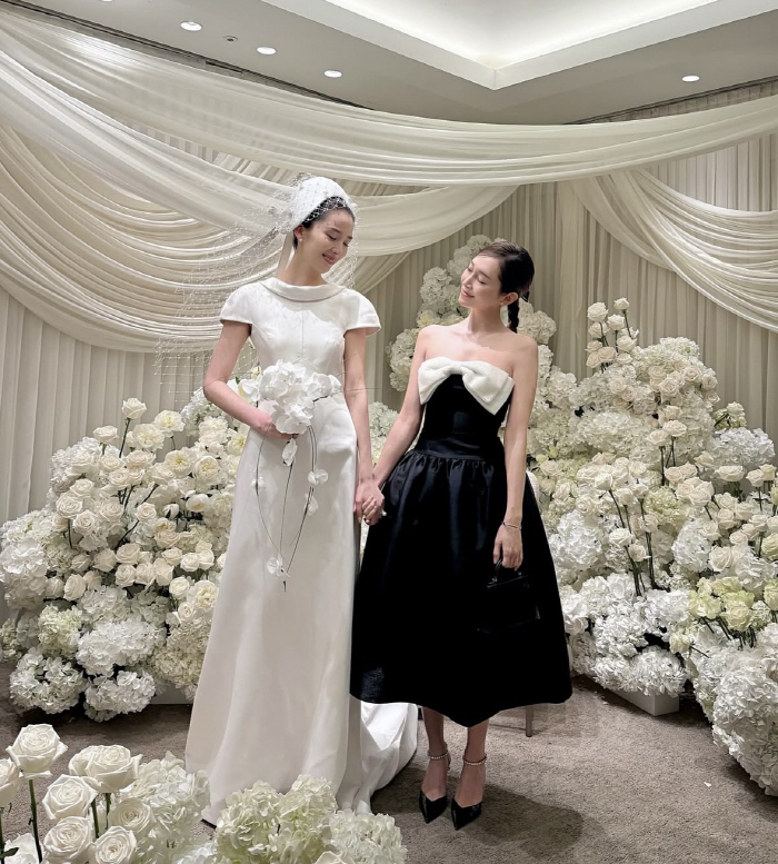 Is it Jessica's turn?Jessica, best friend Irene with a bright smile on her wedding day 