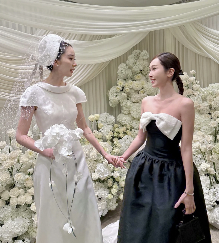 Is it Jessica's turn?Jessica, best friend Irene with a bright smile on her wedding day 