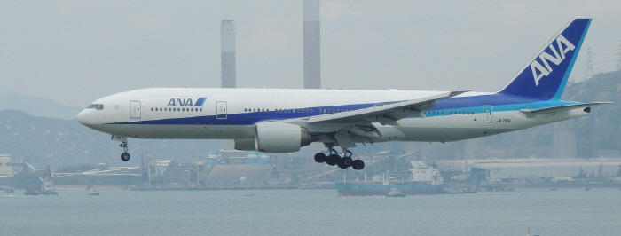 Emergency landing to open the plane's emergency door...Furious passenger punches on bathroom door