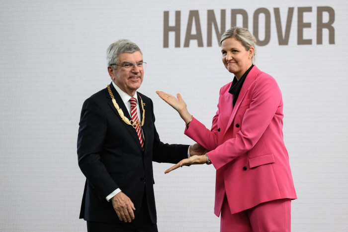 The coronation ceremony of Coventry, the first female head of the IOC, handed over by Chairman Bach