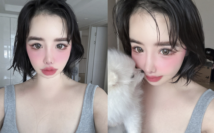 Park Bom's face is covered with pink blusher and bold pink ♥ love makeup