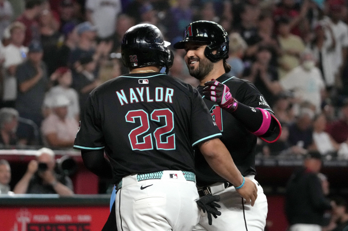 Arizona declares mass sale, Kelly goes to Seattle as trade target first baseman, Suarez also sends