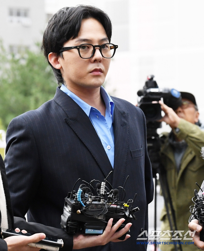 G-Dragon and Yang Hyun-seok, police investigating alleged copyright law violations, raided YG twice