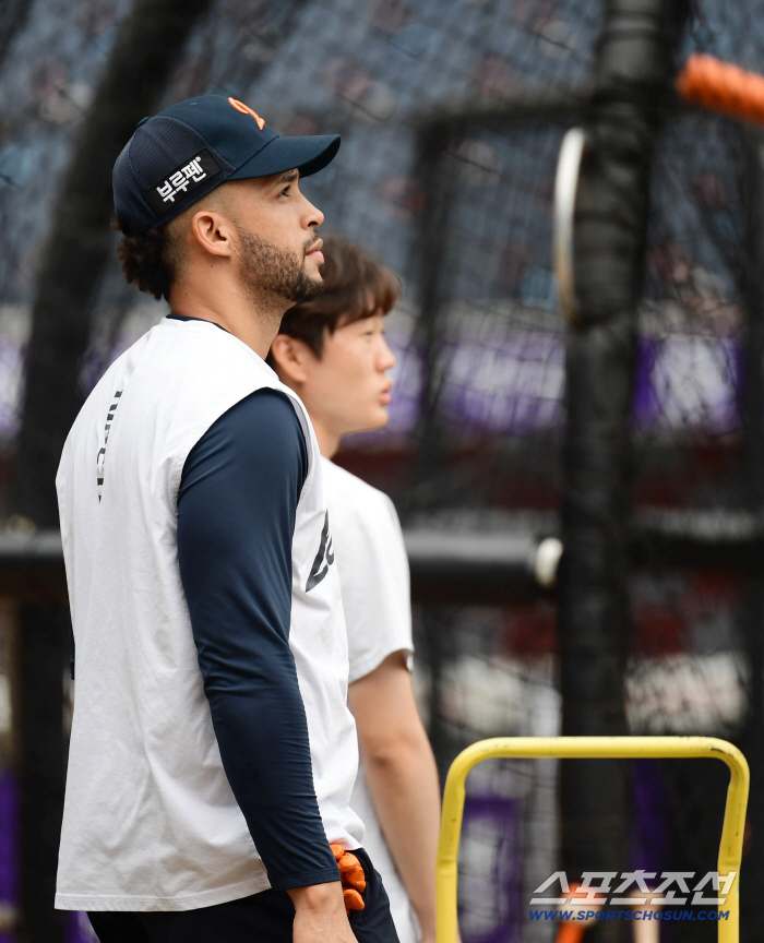  Liberato's batting training with a serious look on his face