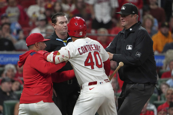 What kind of immoral behavior is this? It's a mistake, but STL's designated hitter's frowned upon throwing the bat at his team's coach
