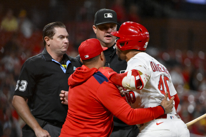 What kind of immoral behavior is this? It's a mistake, but STL's designated hitter's frowned upon throwing the bat at his team's coach