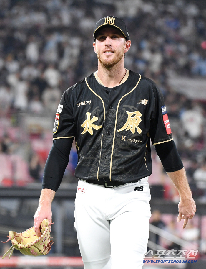  Patrick, who took the mound as a bullpen pitcher, smiles after pitching a scoreless pitch