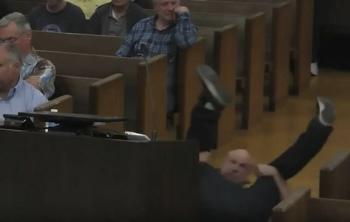 Why did your taxes go up so much? Breakdancing talk during the meeting in protest