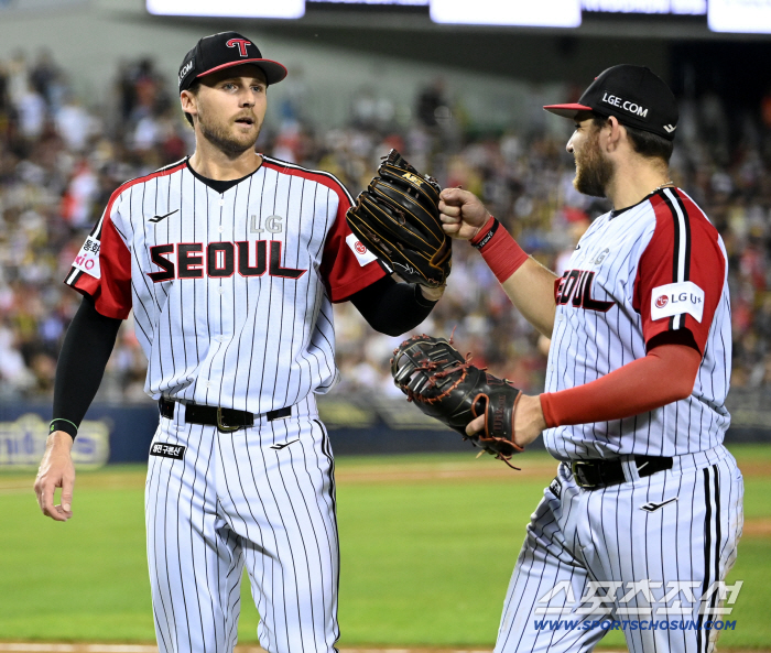  Austin smiles at Tolhurst's scoreless pitching