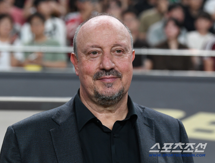  Director Shield Benitez with a relaxed smile