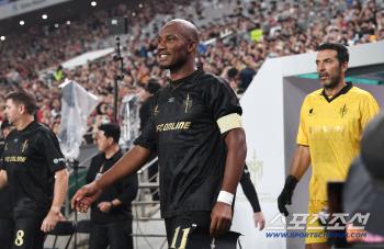  Drogba enters with a confident expression