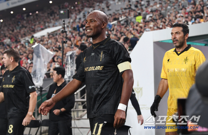  Drogba enters with a confident expression