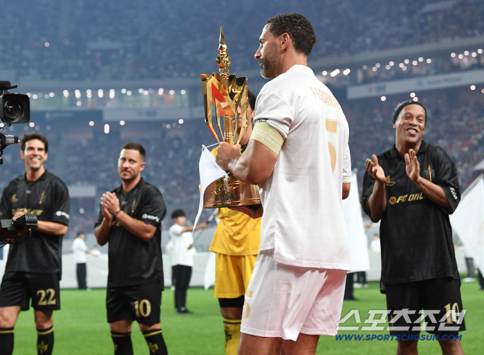  Ferdinand enters with a trophy, Spear team greets with applause