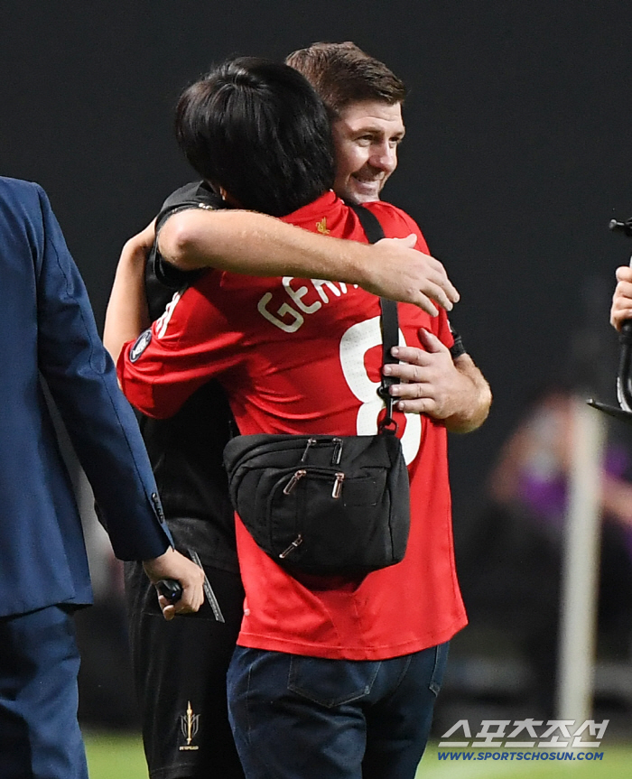  I can't believe the male fan who meets and hugs Gerrard