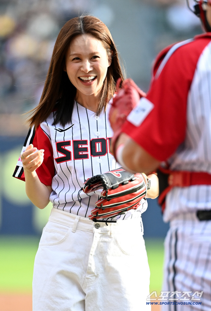  Ivy smiles after the first pitch