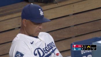 Roberts looking into something and Ohtani looking at it sadly, the party of 50 homers and 50 strikeouts was ruined