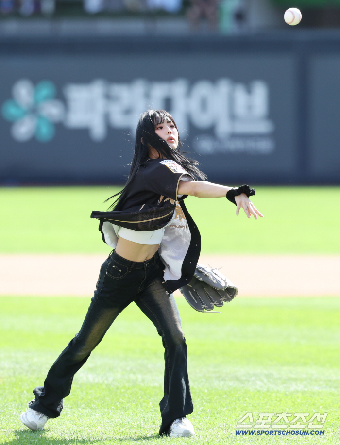  Aichilyn Juni's strong first pitch in a baseball uniform