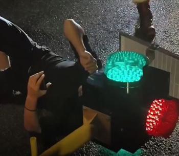 A man with his head caught in a traffic light due to a motorcycle accident...an accident as rare as winning the lottery