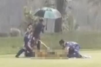Caddie who was struck by lightning on the golf course dies...Controversy over forced play amid heavy rain