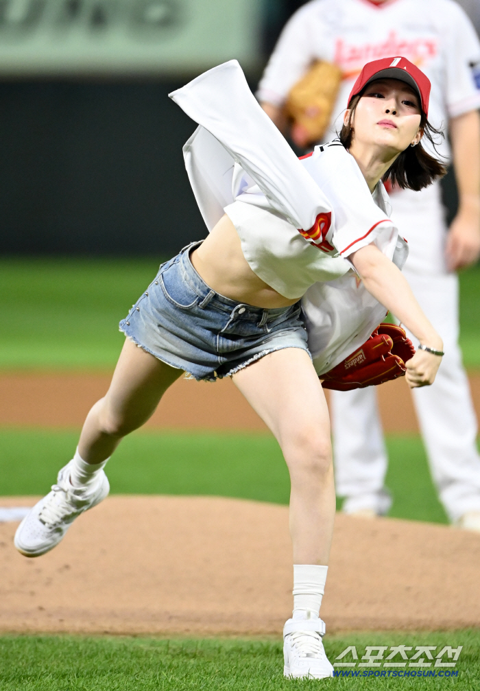  Queen's Eye Serbin throws the first pitch in a sleek pitching form