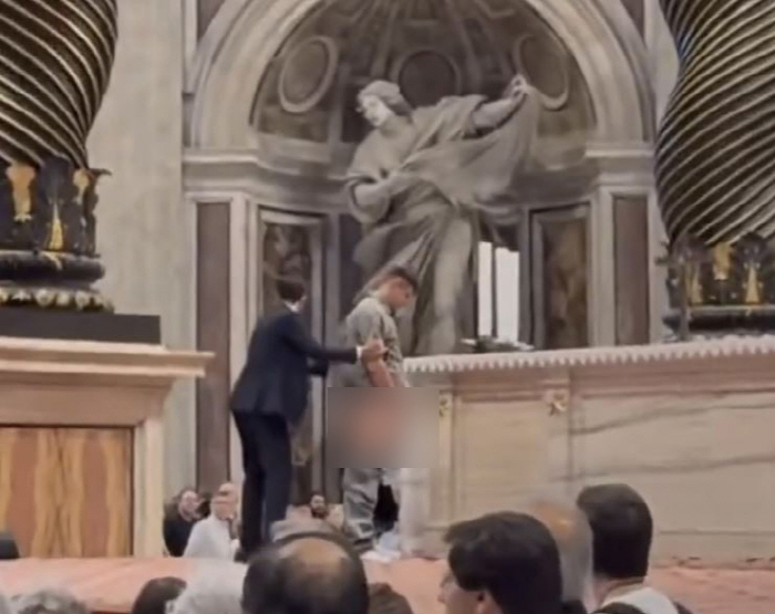 Men pee during Mass at St. Peter's Basilica at the Vatican...Exposure shock as it is on the lower body