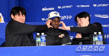  Benon smiles after receiving a double cheek heart