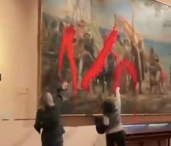 What are the women who sprayed red paint on a 133-year-old painting?