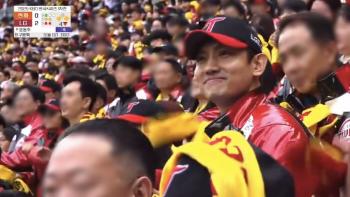 LG Twins fan Choi Kang Chang-min captured it in the general cheering section, not in the VIP seat..the ascension of one's cheekbones