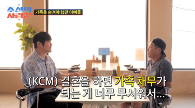 KCM holds her daughter's first open hand for 12 years and is happiest in a normal moment