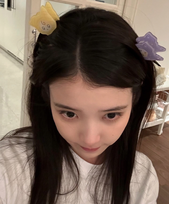 IU Reveals Diverse Looks and Behind-the-Scenes Moments in Latest SNS Update