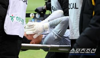  Kim Kyung-min being carried off on a stretcher