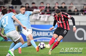  Lucas tries a powerful mid-range shot